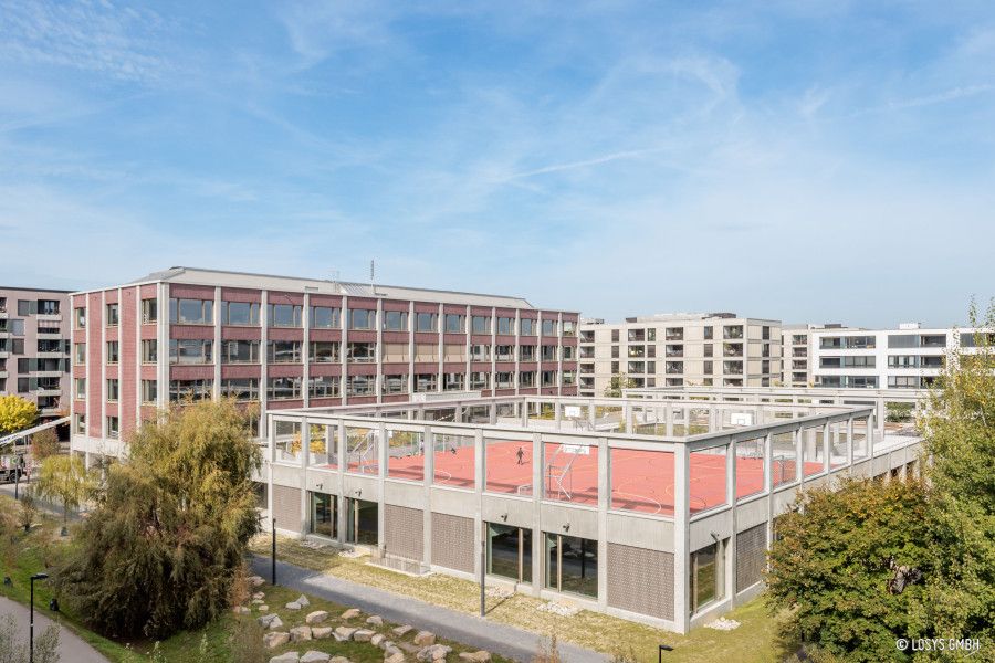 w900-h600-7476_653a13351e4dc_neubau-schulanlage-glattpark-jpg.jpg